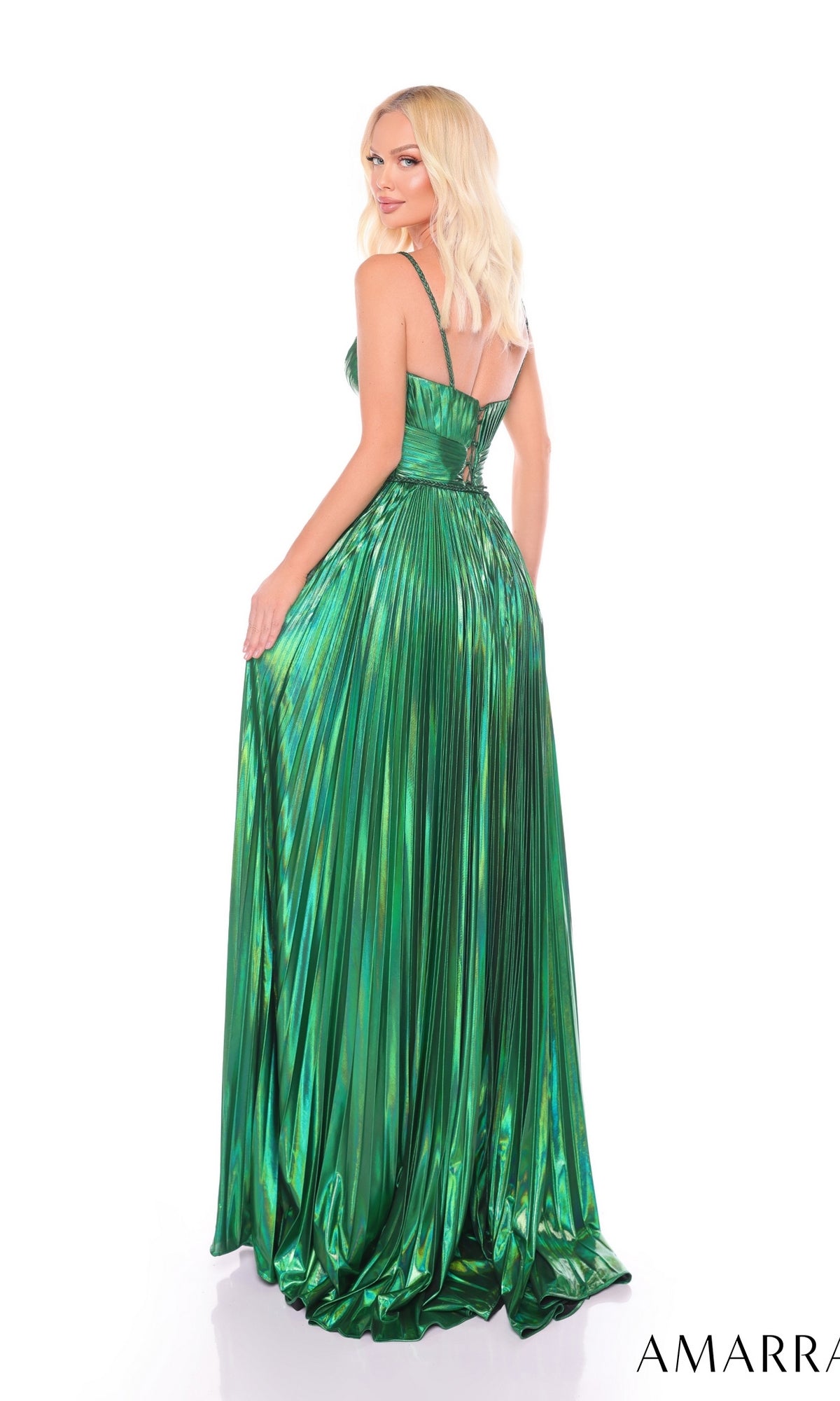 A woman faces away, glancing over her shoulder in the Long Formal Dress 88096 by Amarra?a shiny metallic green pleated A-line gown with thin straps and a fitted bodice for an elegant, eye-catching look.